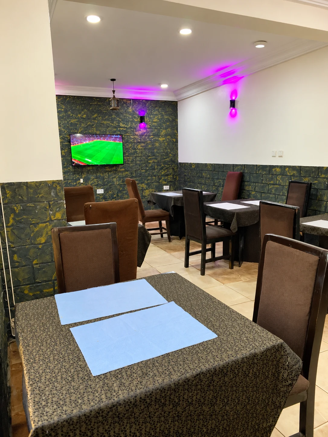 Wide view of the restaurant dining area with tables and chairs