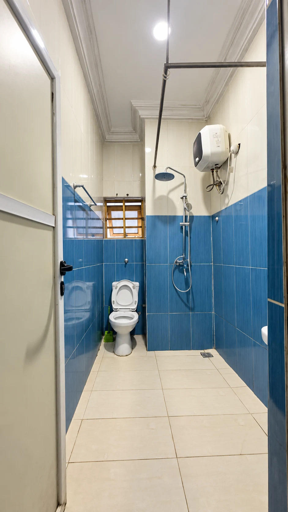 Standard Room blue tiled en-suite shower room